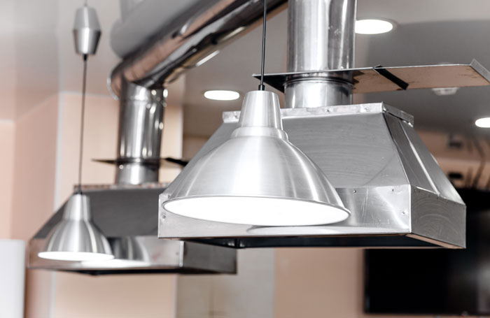 Elegant stainless steel kitchen extractor fan in restaurant